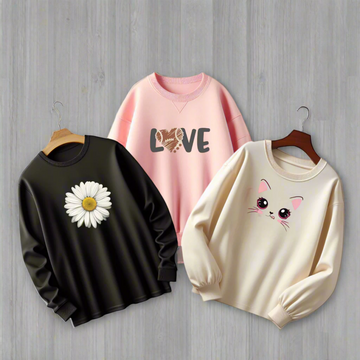 "Pack of 3 AUA&CO Women's Sweatshirts: One cream beige sweatshirt with a Caty print, one black sweatshirt with a sunflower print, and one pink sweatshirt with stylish love writing, all made from soft fleece for warmth and comfort."