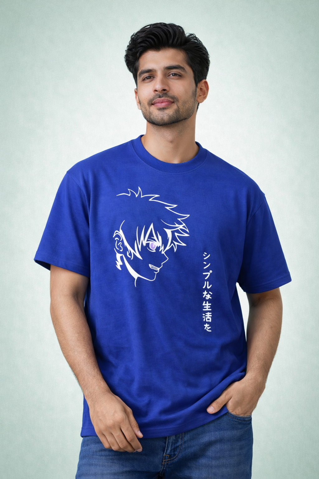 Man wearing a blue t-shirt with a graphic design and text on a light gray background