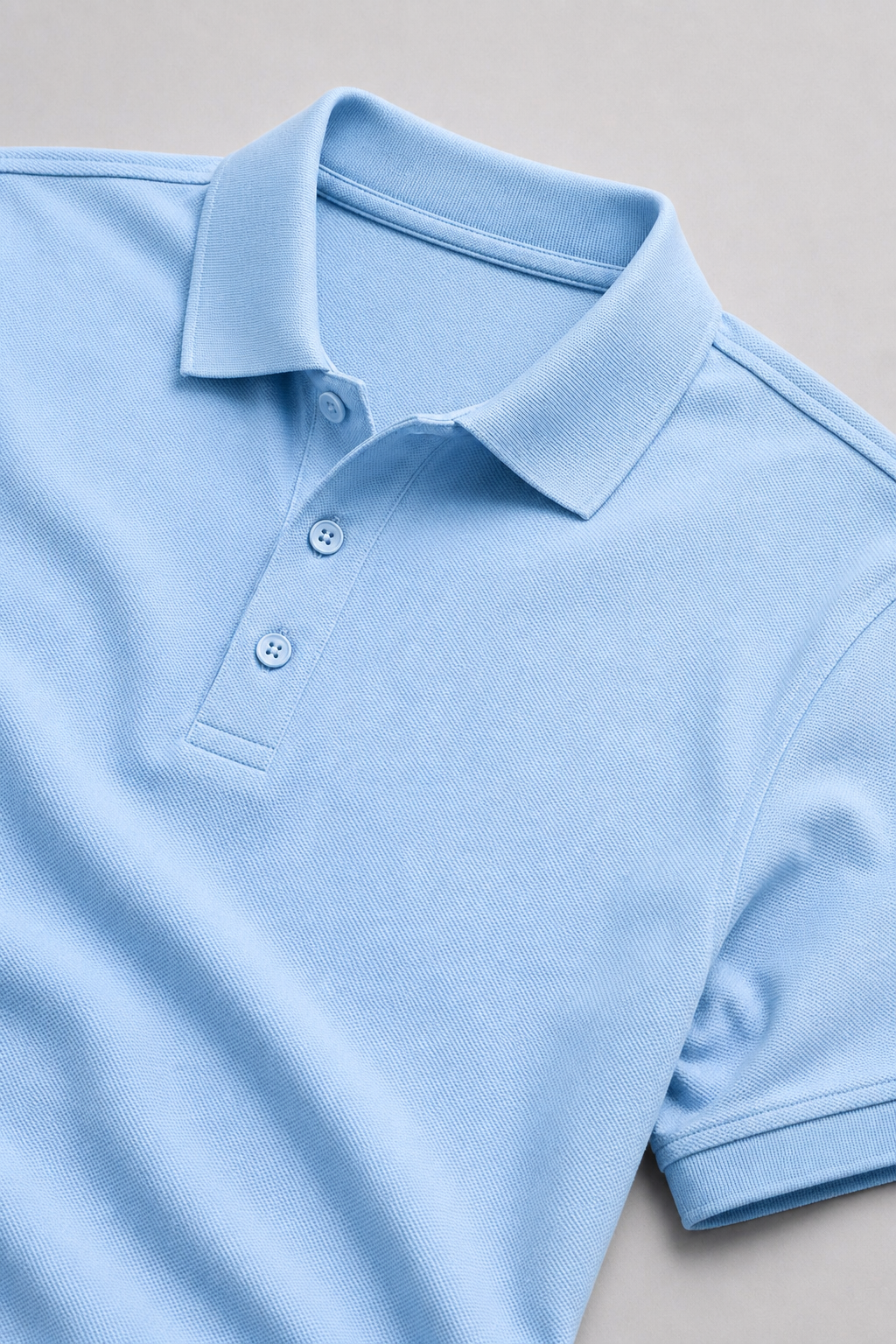 Two polo shirts, one blue and one light blue, on a gray background with 'Free Delivery' text.