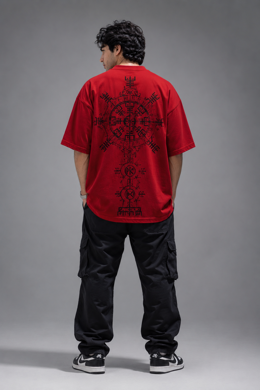 Male model wearing AUA&CO red oversized baggy graphic t-shirt in back view
