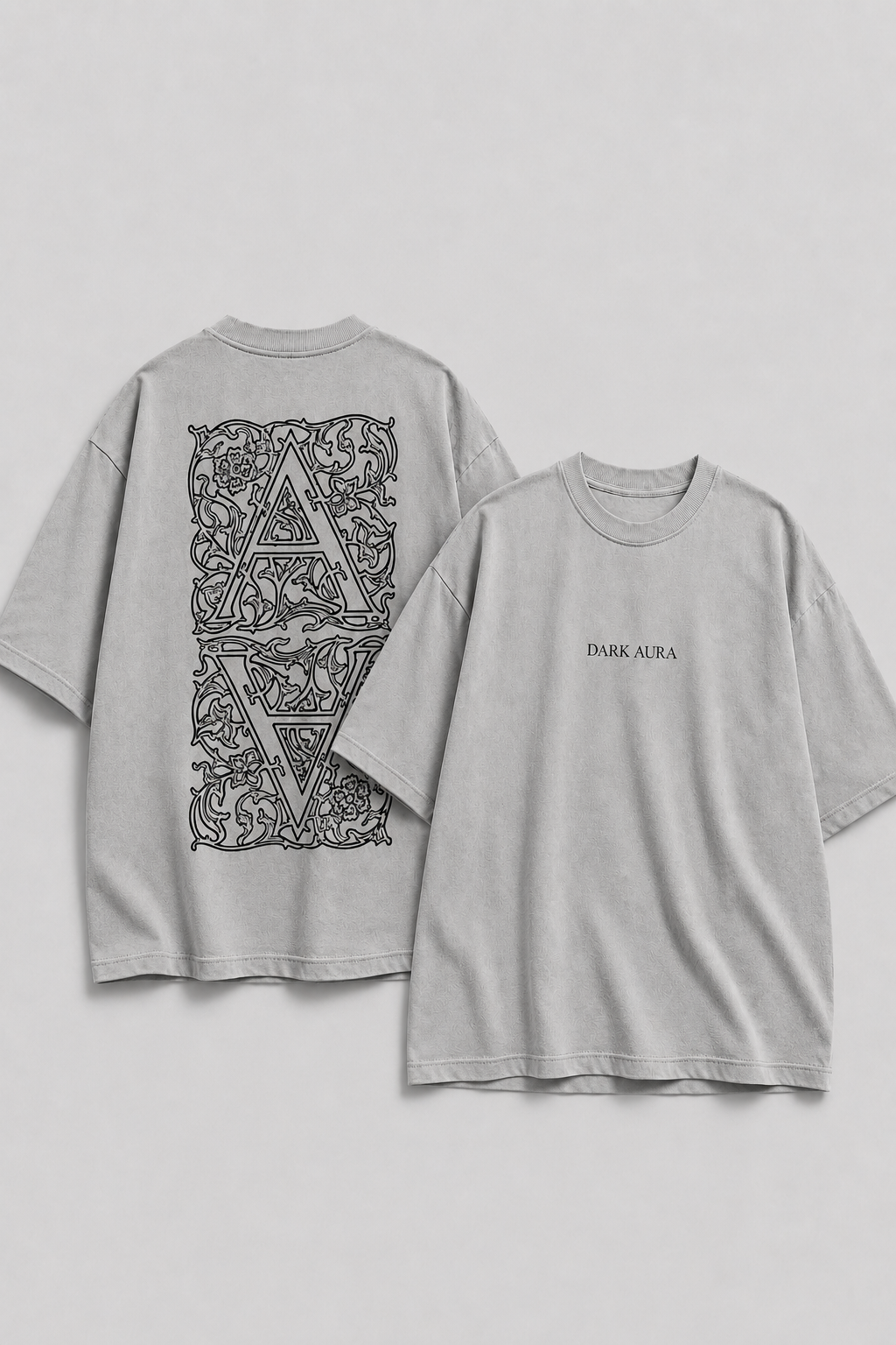 Gray t-shirt with black geometric design on front and text on back against a light gray background