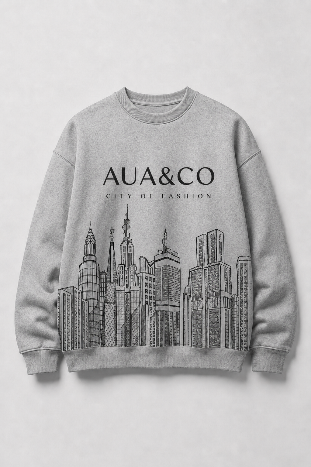 A light gray crewneck sweatshirt featuring a black line art graphic of a city skyline and the text 'AUA&CO' and 'CITY OF FASHION' printed on the chest, displayed against a neutral light gray background.