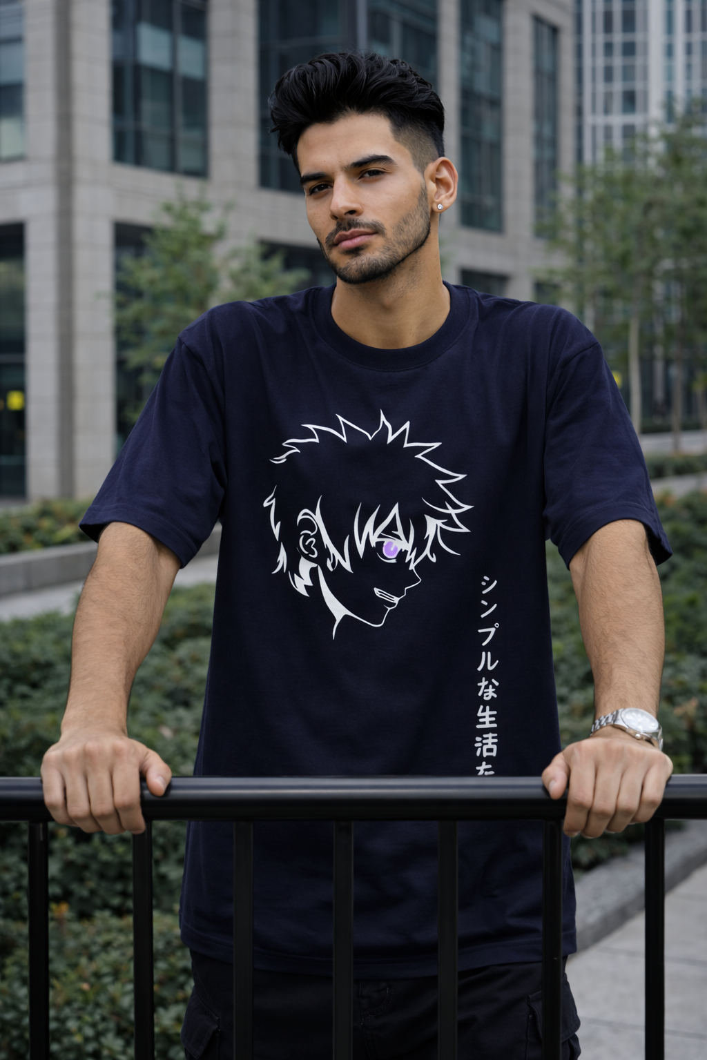 Man wearing a navy blue t-shirt with a white graphic design outdoors.