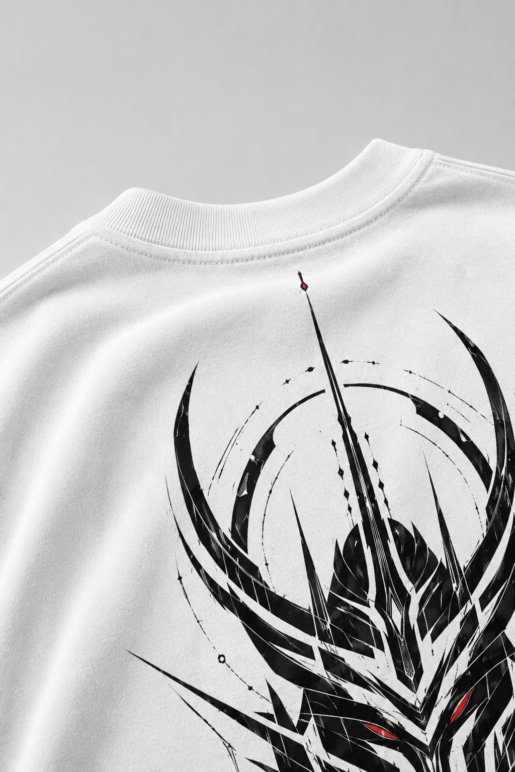 White sweatshirt with black and red graphic design on a gray background