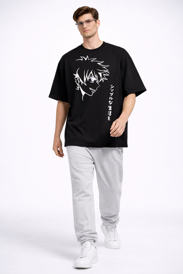 Man wearing a black t-shirt with white graphics and text, standing against a white background