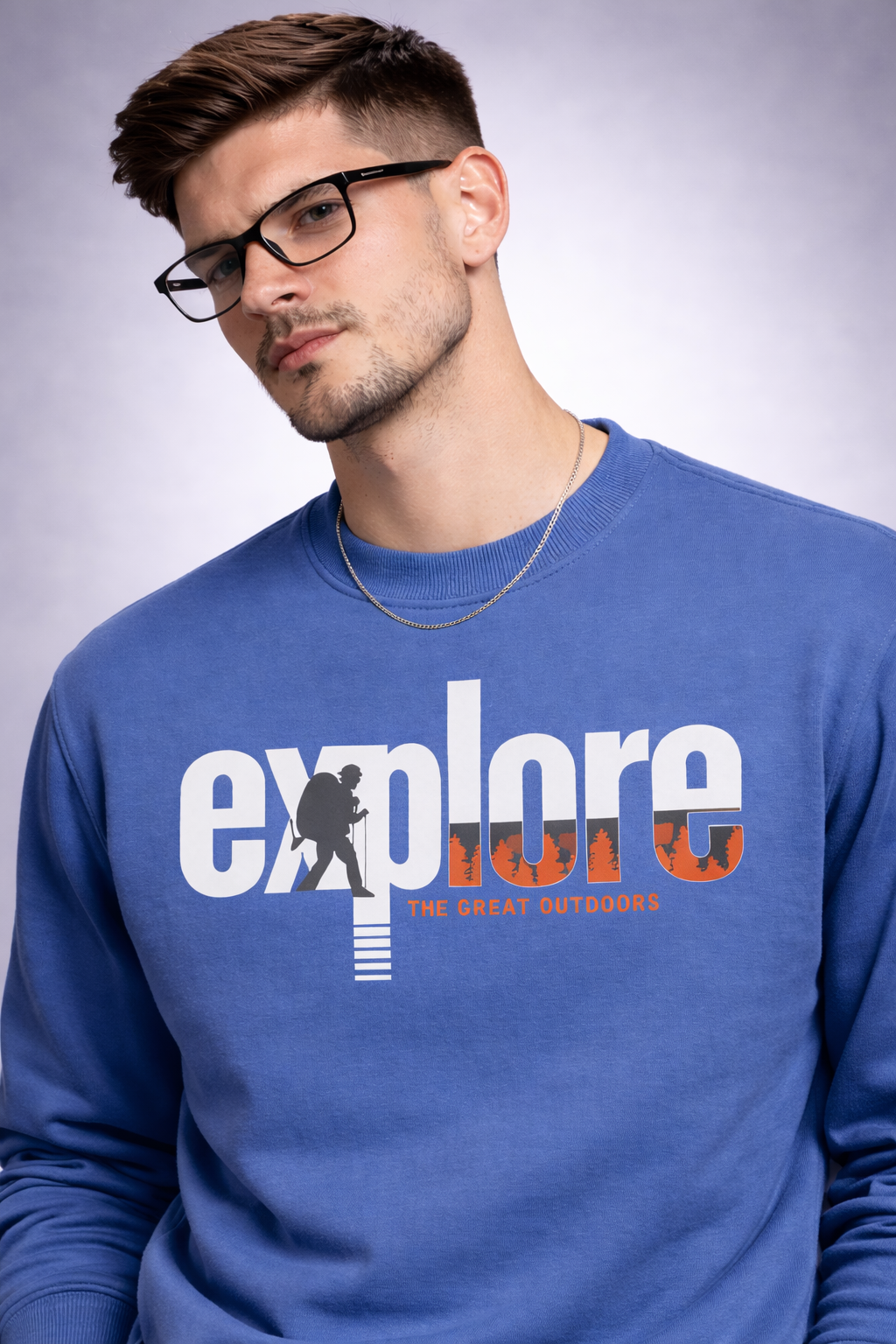 Man wearing a blue sweatshirt with 'explore the great outdoors' text and graphic.