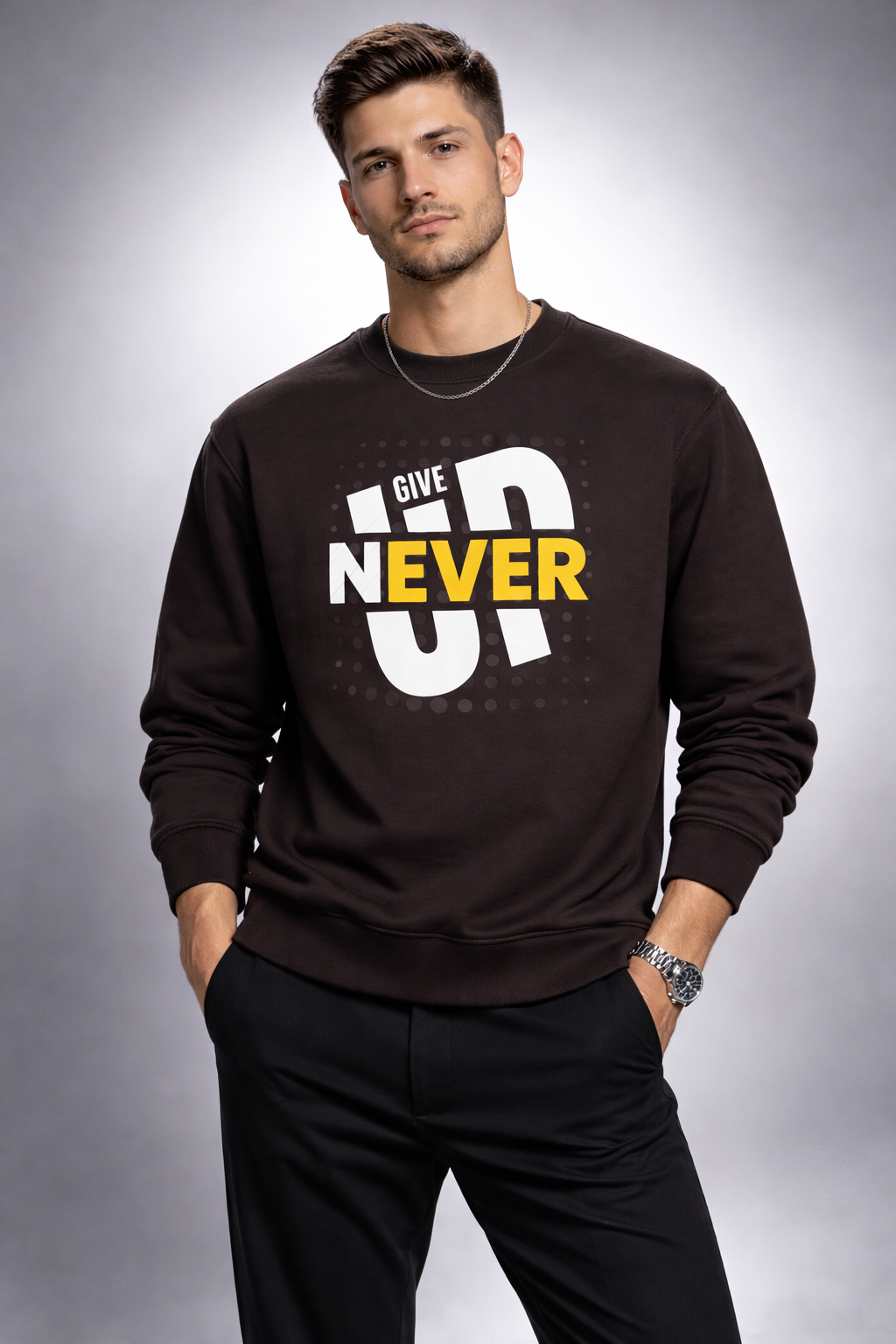 Man wearing a black sweatshirt with 'Give Up Never' text on a gray background