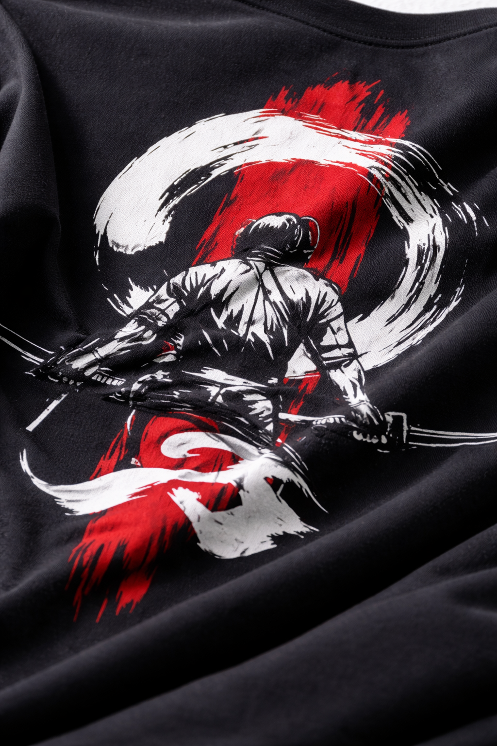 Black shirt with a graphic design of a warrior holding a sword against a red and white circle background.
