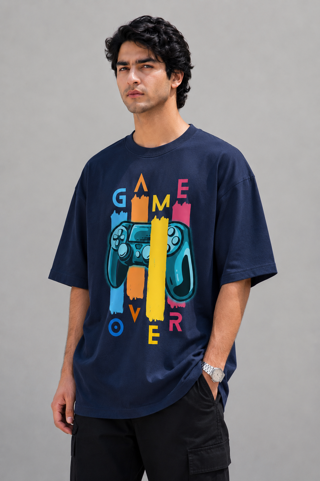 Man wearing a navy blue t-shirt with colorful graphics and text on a gray background