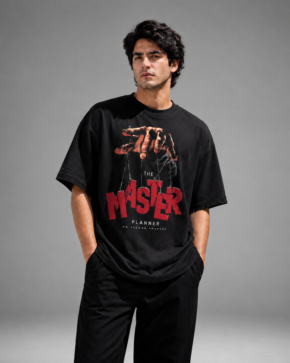 Man wearing a black t-shirt with a graphic design and text on a gray background