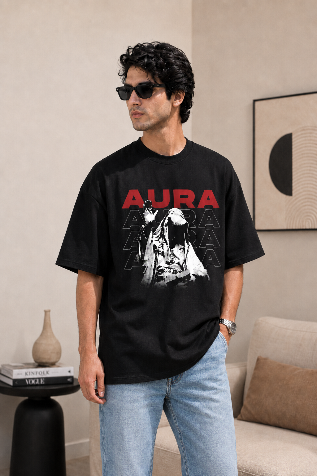 Black t-shirt with 'Aura' graphic design on a gray background