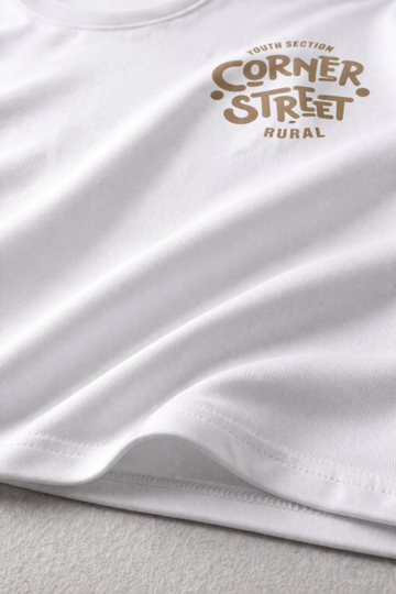 White t-shirt with brown text on a light gray background