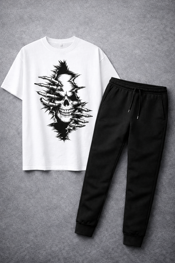 White t-shirt with black skull design and black pants on a gray background
